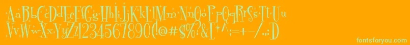 Pudelinka-Schriftart – Grüne Schriften auf orangefarbenem Hintergrund