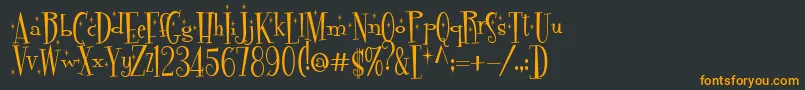 Pudelinka-Schriftart – Orangefarbene Schriften auf schwarzem Hintergrund