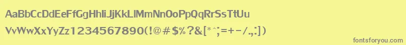 Lilyupc-fontti – harmaat kirjasimet keltaisella taustalla