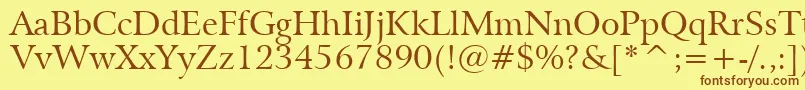 フォントBitstreamArrusBt – 茶色の文字が黄色の背景にあります。