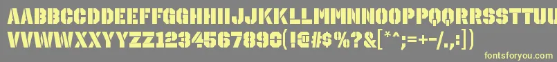 Czcionka OctinstencilblRegular – żółte czcionki na szarym tle