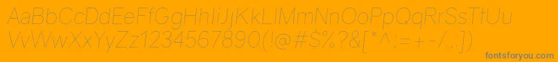 GravityUltralightitalic-Schriftart – Graue Schriften auf orangefarbenem Hintergrund