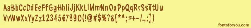 フォントKasuaariKirjastossa – 茶色の文字が黄色の背景にあります。