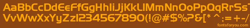 フォントAsylbekm09handel.Kz – オレンジ色の文字が茶色の背景にあります。