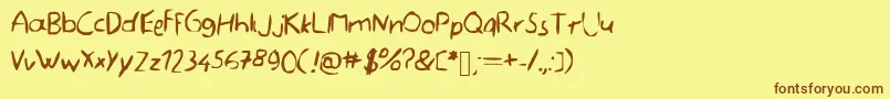 フォントMemefont – 茶色の文字が黄色の背景にあります。