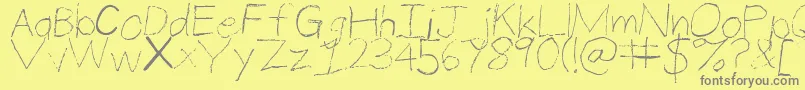 ThinPencilHandwriting-fontti – harmaat kirjasimet keltaisella taustalla