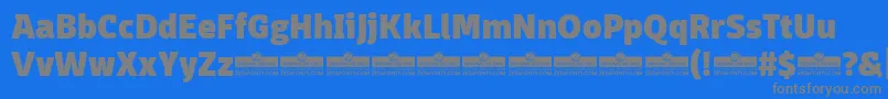 DomotikaHeavyTrial-fontti – harmaat kirjasimet sinisellä taustalla