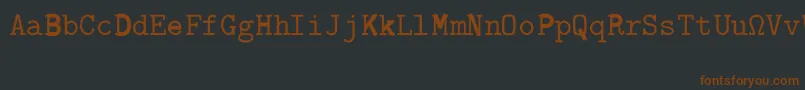 Fonte CmTypewriterRegular – fontes marrons em um fundo preto