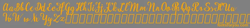 MaudlynDemo-Schriftart – Orangefarbene Schriften auf grauem Hintergrund