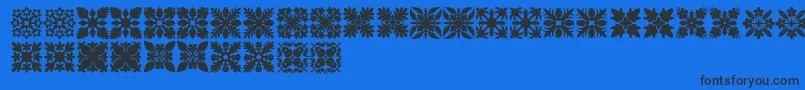 HawaiianQuilt1-Schriftart – Schwarze Schriften auf blauem Hintergrund