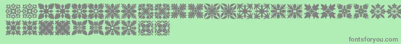 HawaiianQuilt1 Font – Gray Fonts on Green Background