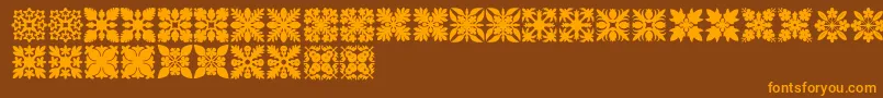 HawaiianQuilt1-Schriftart – Orangefarbene Schriften auf braunem Hintergrund