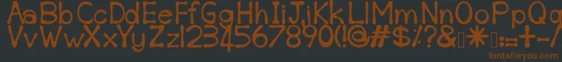 Sempoi-fontti – ruskeat fontit mustalla taustalla