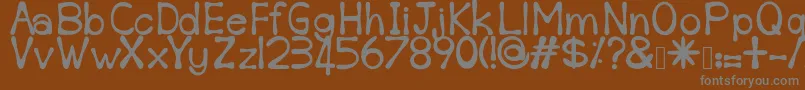 Sempoi-fontti – harmaat kirjasimet ruskealla taustalla