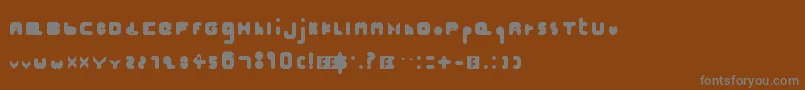 Hellogoodbye-fontti – harmaat kirjasimet ruskealla taustalla