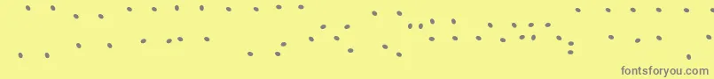 JuicyFruityHighlights-fontti – harmaat kirjasimet keltaisella taustalla