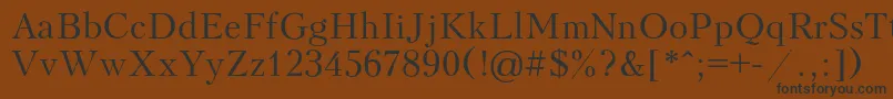 フォントKudriashovRegular – 黒い文字が茶色の背景にあります