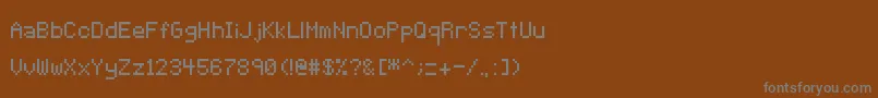 Czcionka Pixeltype – szare czcionki na brązowym tle