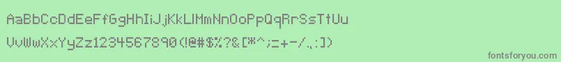 Fonte Pixeltype – fontes cinzas em um fundo verde
