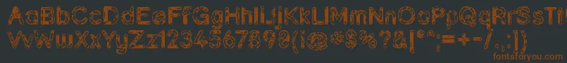 Grunja ffy-Schriftart – Braune Schriften auf schwarzem Hintergrund