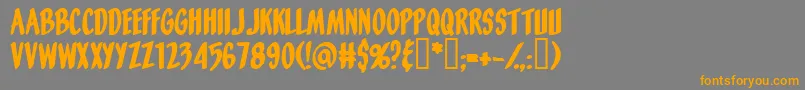 フォントOrangefizz – オレンジの文字は灰色の背景にあります。