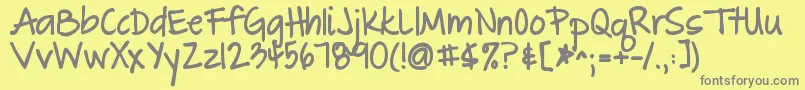 フォントThegreatescapebold – 黄色の背景に灰色の文字
