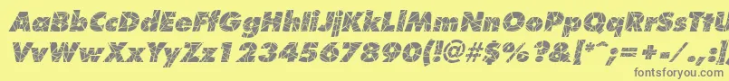 ShatterItalic-fontti – harmaat kirjasimet keltaisella taustalla