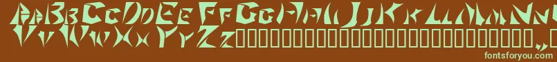 フォントSabertoo – 緑色の文字が茶色の背景にあります。