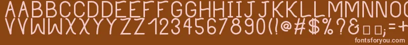PhilippineBold-fontti – vaaleanpunaiset fontit ruskealla taustalla