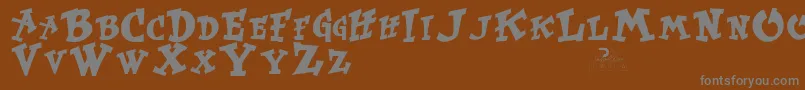KurtrussellRegular-Schriftart – Graue Schriften auf braunem Hintergrund