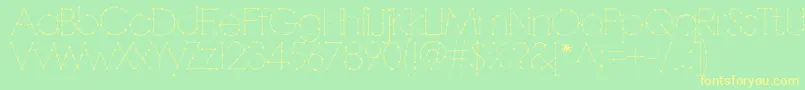 フォントBarbarello – 黄色の文字が緑の背景にあります