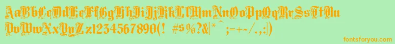 フォントMiddlesaxonytext – オレンジの文字が緑の背景にあります。