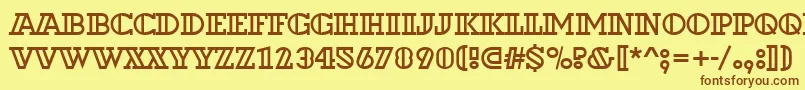 フォントDextoroutd – 茶色の文字が黄色の背景にあります。