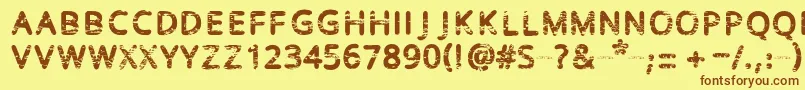 フォントBaston – 茶色の文字が黄色の背景にあります。