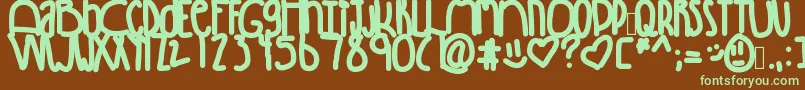 フォントWinning – 緑色の文字が茶色の背景にあります。