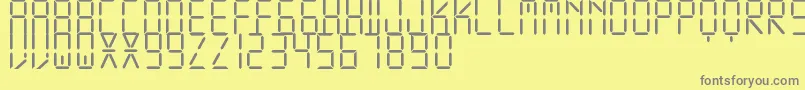 フォントDisplayFreeTfb – 黄色の背景に灰色の文字