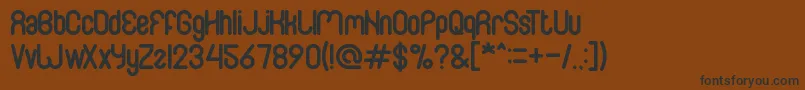 Familyandfriend Font – Black Fonts on Brown Background