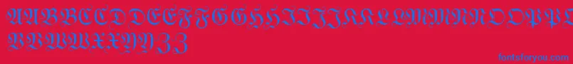 WittewittmajusclesFlourish-Schriftart – Blaue Schriften auf rotem Hintergrund