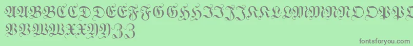 WittewittmajusclesFlourish-Schriftart – Graue Schriften auf grünem Hintergrund