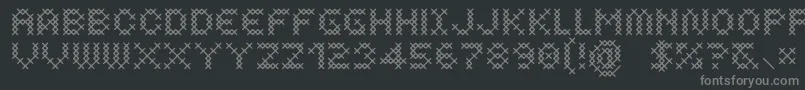 CosturaRegular-fontti – harmaat kirjasimet mustalla taustalla