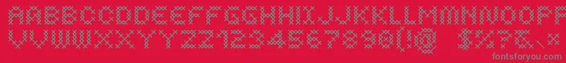 フォントCosturaRegular – 赤い背景に灰色の文字