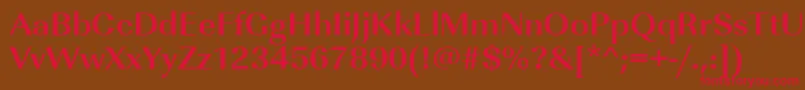 フォントUrwimperialtwidBold – 赤い文字が茶色の背景にあります。