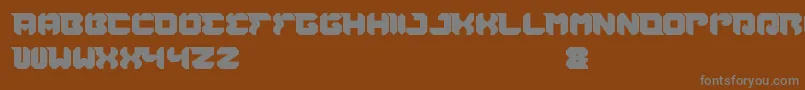RhinocerosBreakTheWall-fontti – harmaat kirjasimet ruskealla taustalla