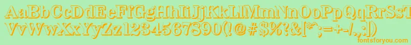 フォントWichitashadowBold – オレンジの文字が緑の背景にあります。