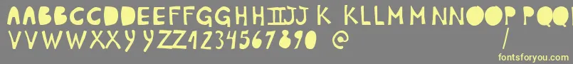 PlumonCp1 Font – Yellow Fonts on Gray Background
