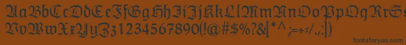 フォントHumboldtfrakturZier – 黒い文字が茶色の背景にあります