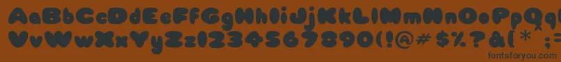 Babycake Font – Black Fonts on Brown Background
