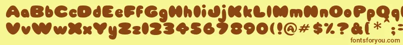 フォントBabycake – 茶色の文字が黄色の背景にあります。