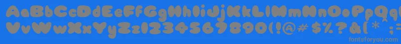 Fonte Babycake – fontes cinzas em um fundo azul