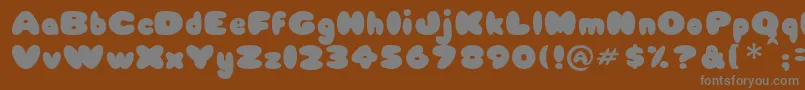 Babycake-fontti – harmaat kirjasimet ruskealla taustalla